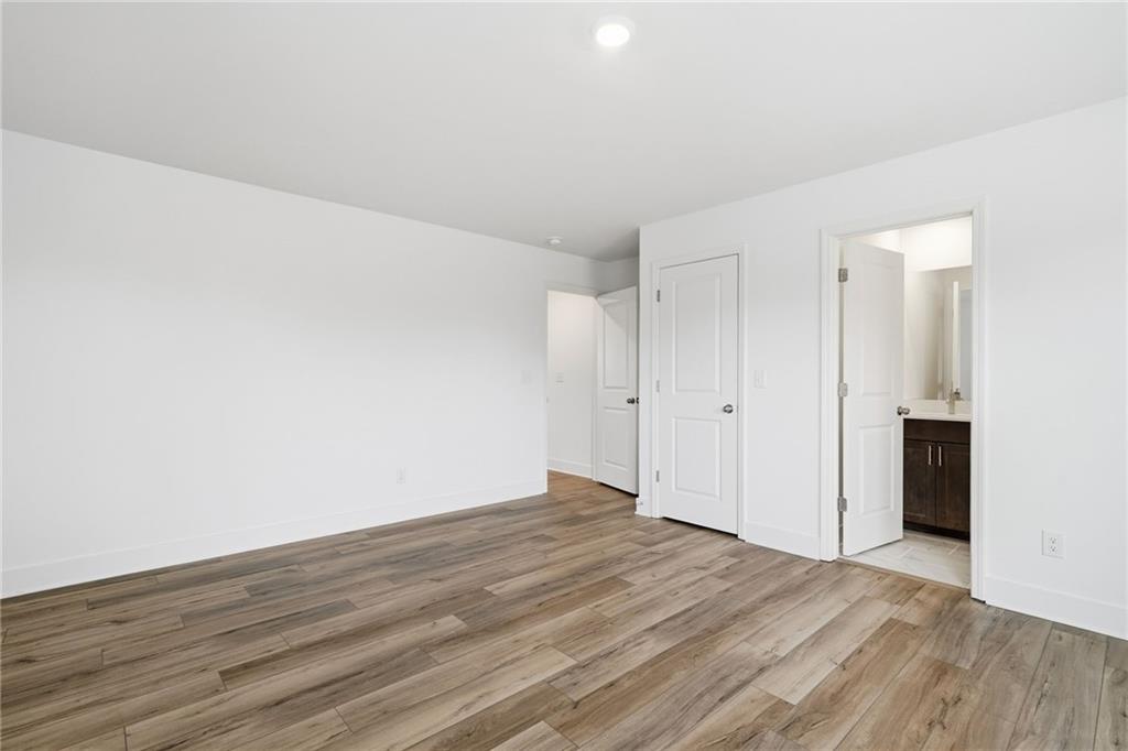 259 Deer Valley Run Canton, GA 30115 - Photo 20 of 25 a view of an empty room and wooden floor