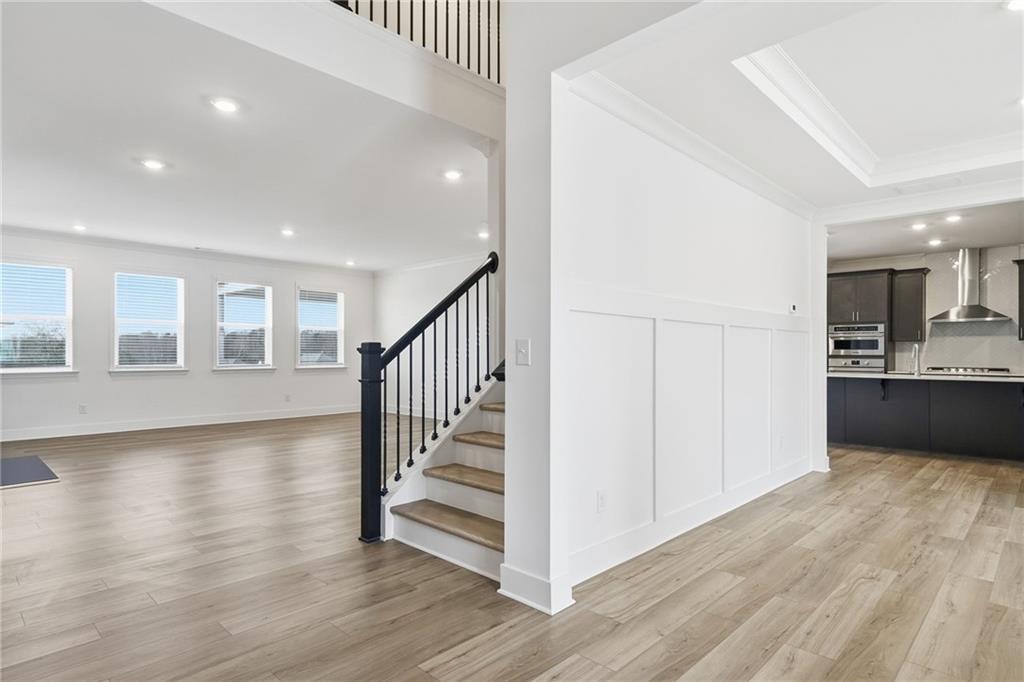 259 Deer Valley Run Canton, GA 30115 - Photo 2 of 25 a view of a hallway with wooden floor and windows