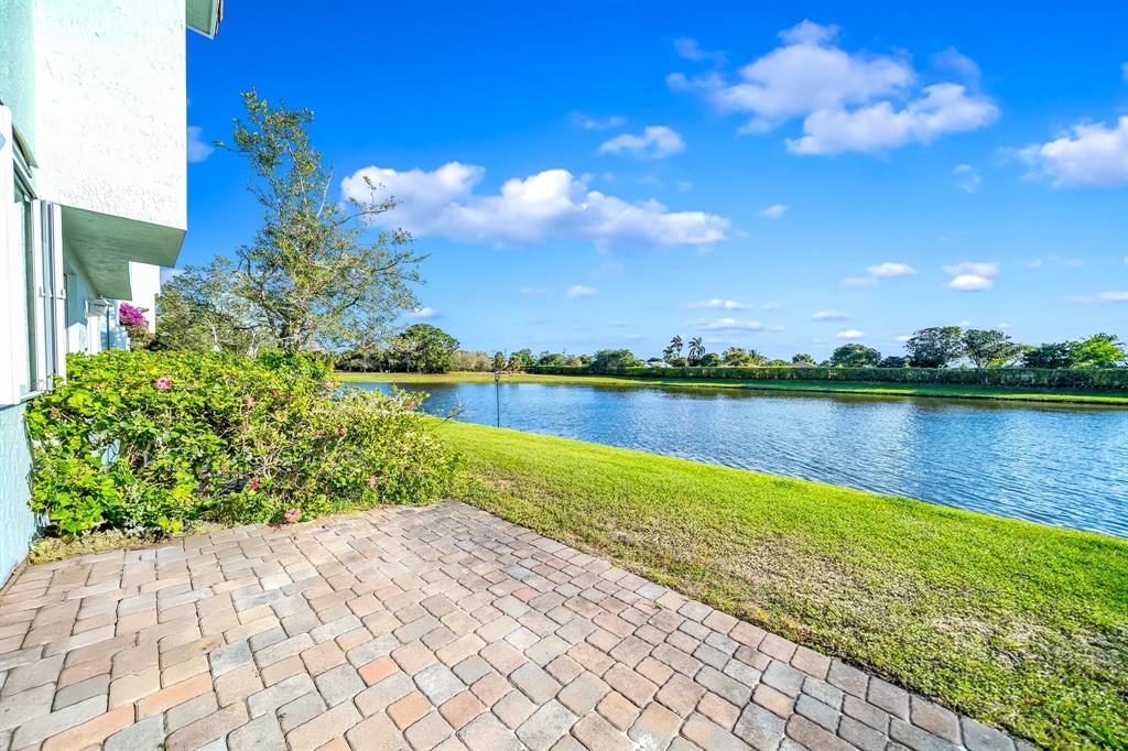 3141 Laurel Ridge Circle Riviera Beach, FL 33404 - Photo 19 of 28 a view of a lake with a big yard