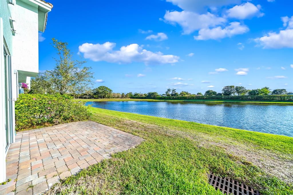 3141 Laurel Ridge Circle Riviera Beach, FL 33404 - Photo 21 of 28 a view of a lake with houses in the back