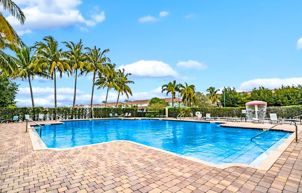 3141 Laurel Ridge Circle Riviera Beach, FL 33404 - Photo 24 of 28 a view of swimming pool with lounge chair