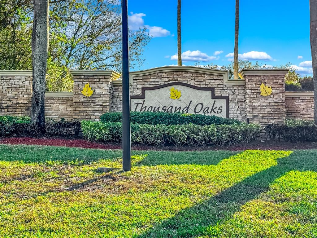 3141 Laurel Ridge Circle Riviera Beach, FL 33404 - Photo 28 of 28 a view of a swimming pool with a yard
