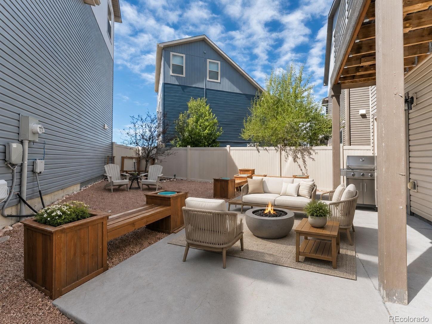 9528 Timberlake Loop Colorado Springs, CO 80927 - Photo 29 of 37 a view of a patio with couches and potted plants