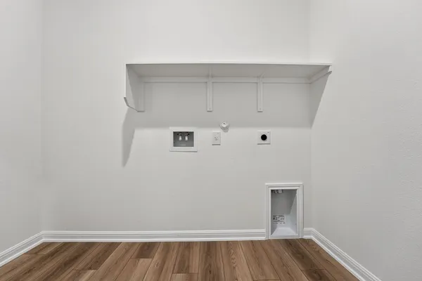 a view of room with wooden floor