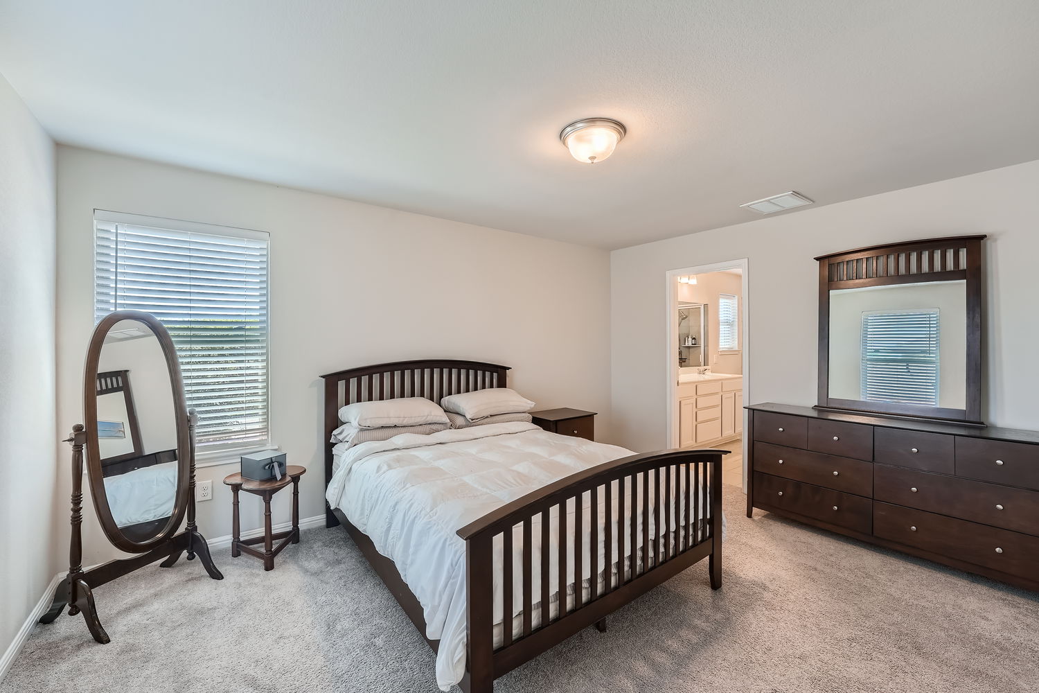 1205 Falconer Way, Unit 91 Austin, TX 78748 - Photo 19 of 39 Bedroom featuring light carpet and ensuite bathroom
