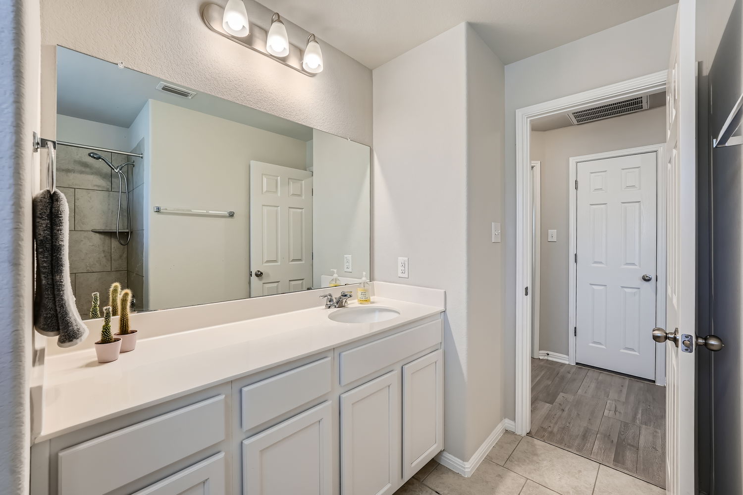 1205 Falconer Way, Unit 91 Austin, TX 78748 - Photo 32 of 39 Full bath with vanity, a shower, and light tile patterned floors