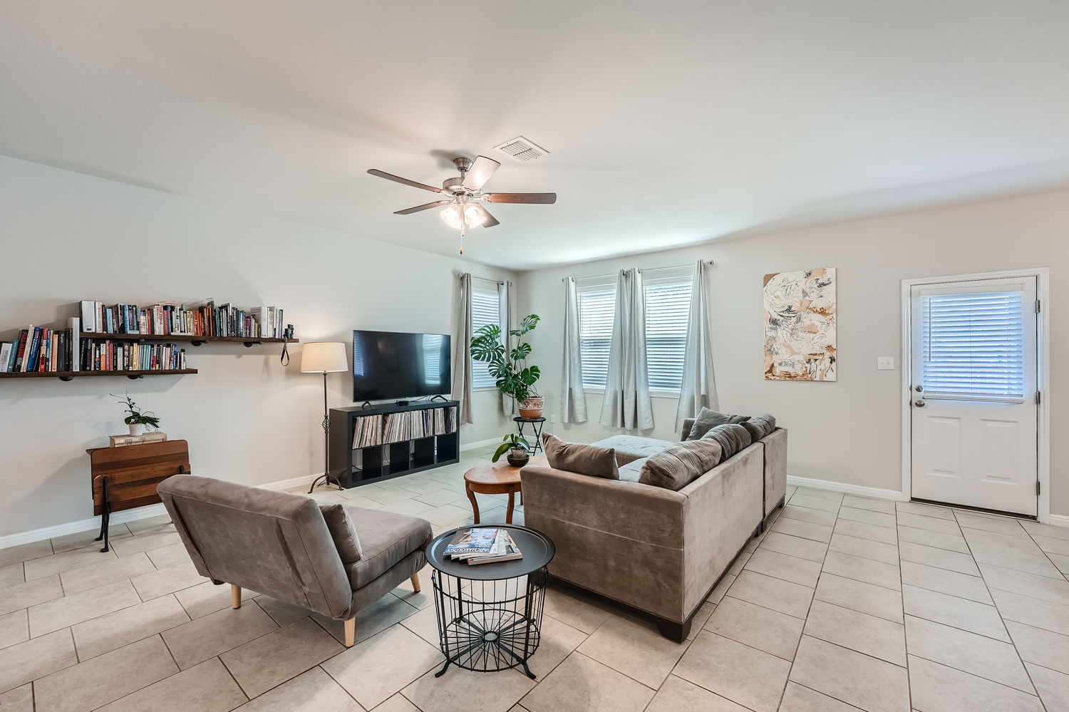 1205 Falconer Way, Unit 91 Austin, TX 78748 - Photo 7 of 39 Living area with ceiling fan and light tile patterned floors