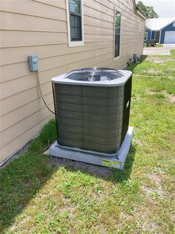 a view of a backyard with plants and a patio