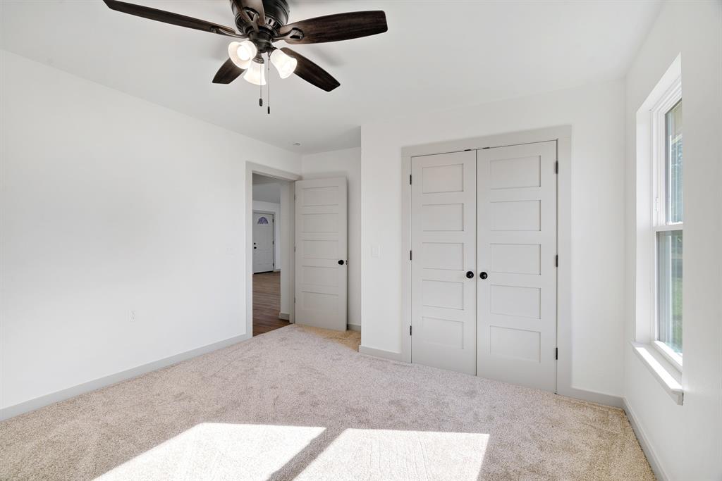 728 County Road Powderly, TX 75473 - Photo 20 of 24 a view of an empty room and chandelier fan