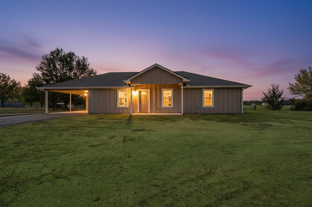 728 County Road Powderly, TX 75473 - Photo 2 of 24 a front view of a house with a garden