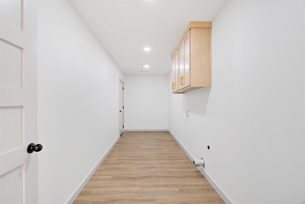 728 County Road Powderly, TX 75473 - Photo 22 of 24 a view of a hallway with wooden floor