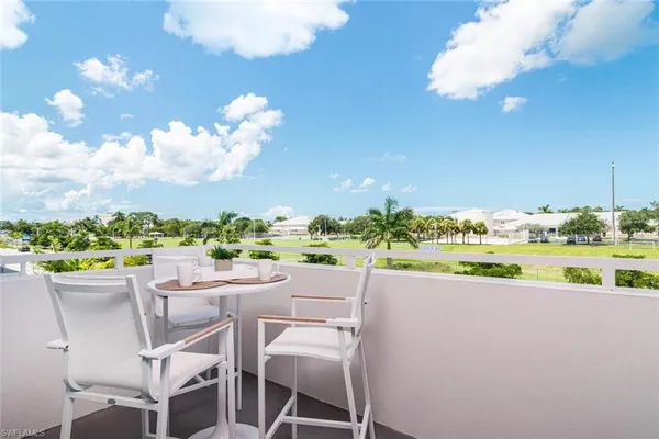 a view of a patio with furniture