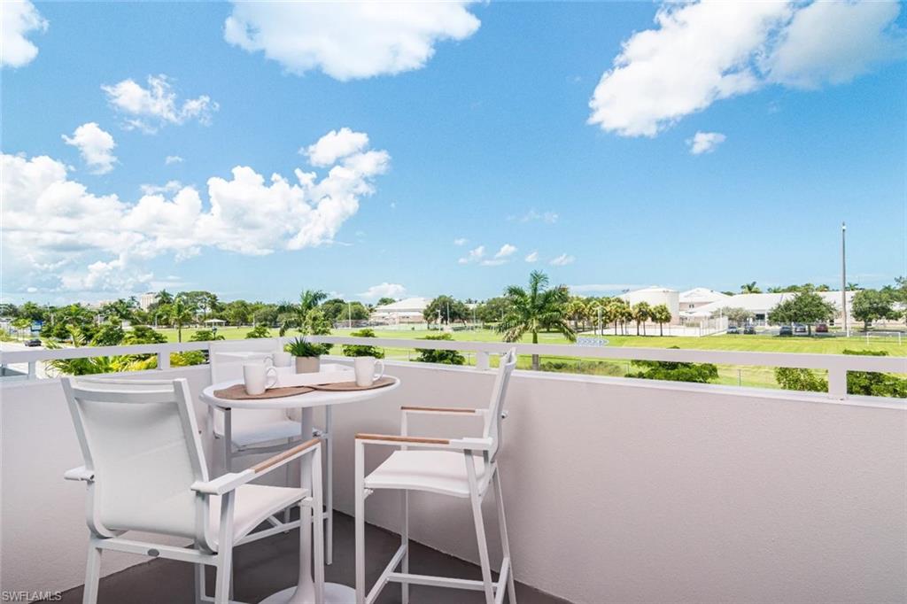 101 8th Street South, Unit 206 Naples, FL 34102 - Photo 9 of 15 a view of a patio with furniture