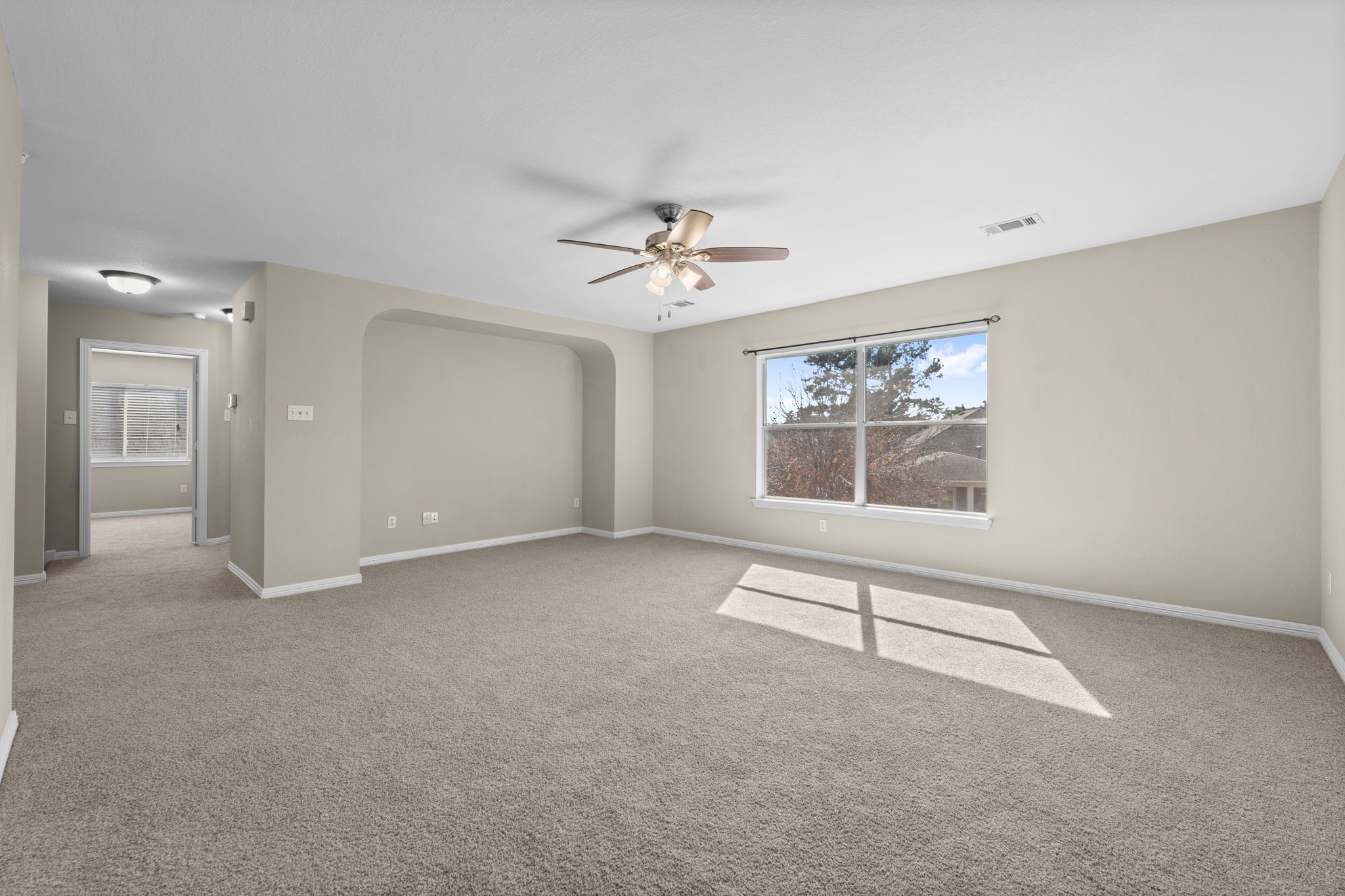 19327 Dickson Park Drive Spring, TX 77373 - Photo 24 of 43 At one end of the Game room is an arched recessed area - the perfect spot for your entertainment center.