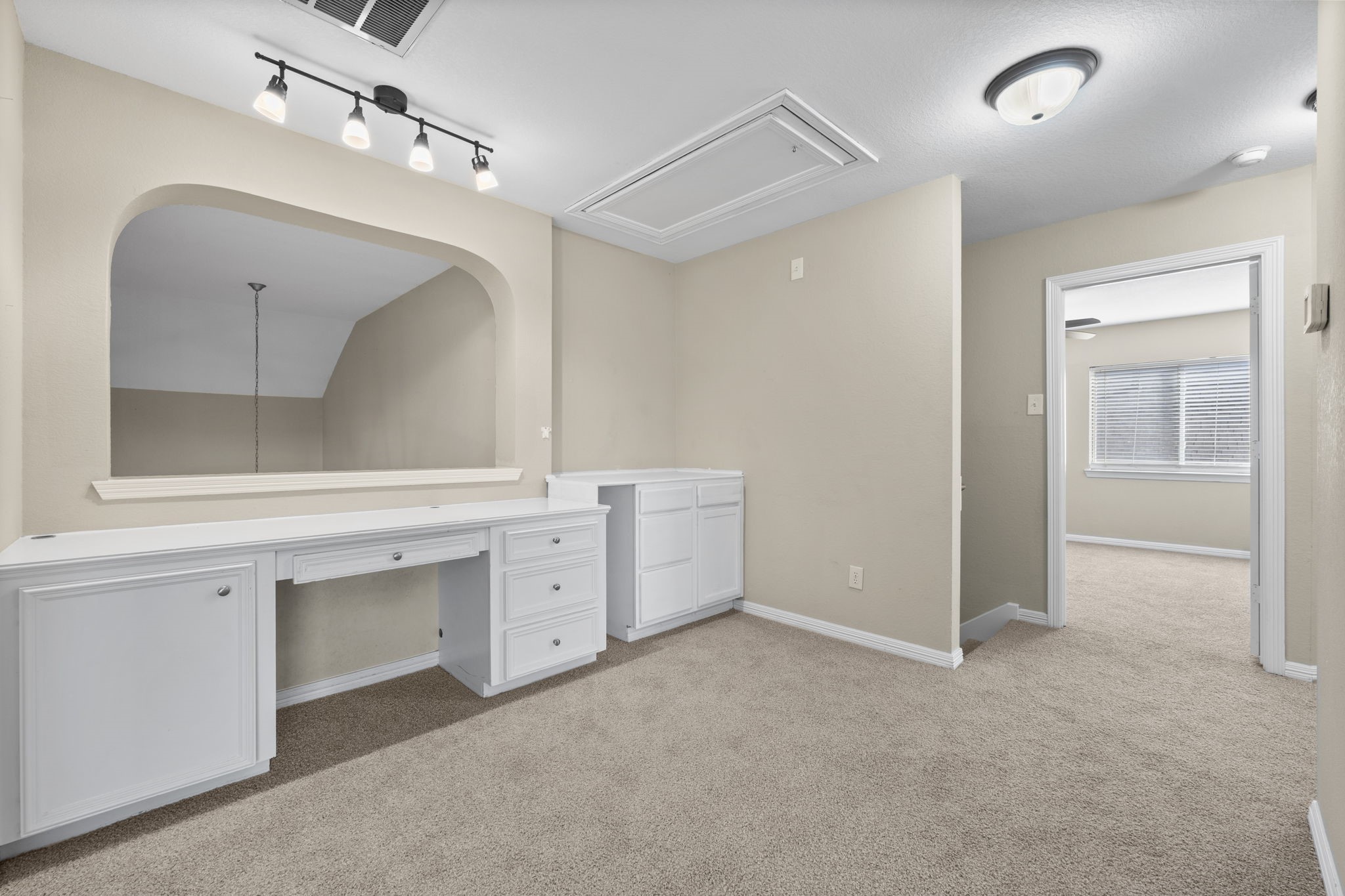 19327 Dickson Park Drive Spring, TX 77373 - Photo 26 of 43 This media area with its cut-out area overlooks the Foyer. It has a built-in desk with open knee space, cabinet, and drawers. Beside the desk sits a cabinet area which would be perfect for a snack bar, popcorn station, or DVD or game storage.