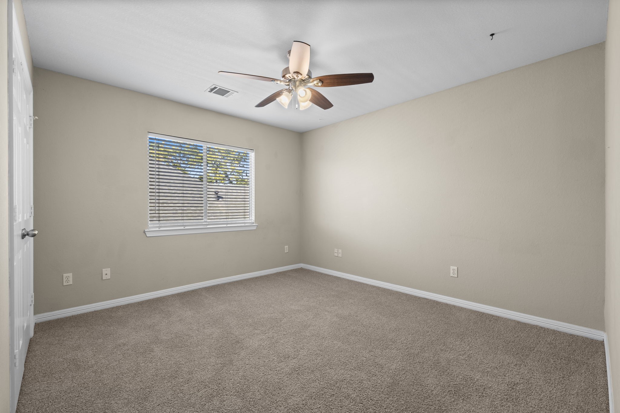 19327 Dickson Park Drive Spring, TX 77373 - Photo 27 of 43 This secondary bedroom features lush carpeting, large wall closet, sunny double window with 2” blinds, and lighted ceiling fan. It has hallway access to the second full bath.
