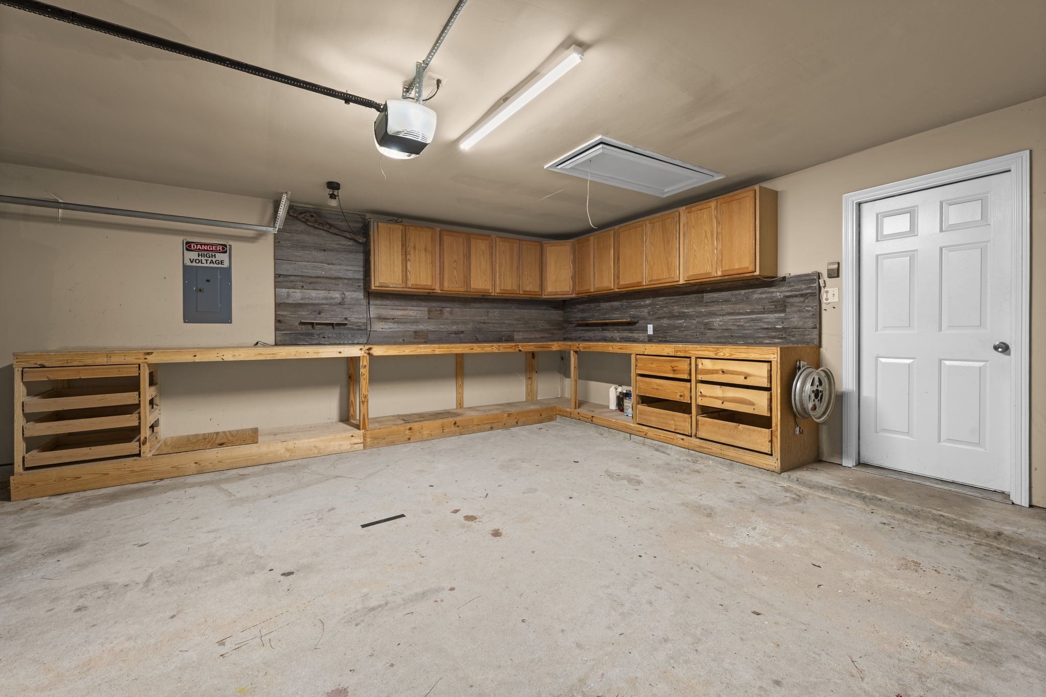 19327 Dickson Park Drive Spring, TX 77373 - Photo 35 of 43 Another view of the all the storage in this garage, including the pull-down attic space.