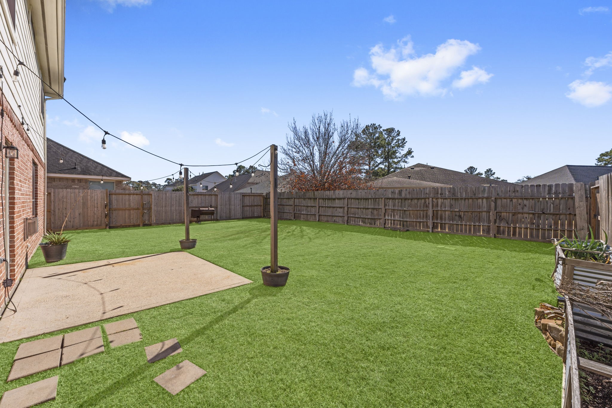 19327 Dickson Park Drive Spring, TX 77373 - Photo 37 of 43 This space is perfect for lounging and enjoying the sights and sounds of nature while waiting for the grill to heat up or relaxing with a cold drink in hand. As the sun sets, you can take in the breathtaking views, making this outdoor area the ideal spot for unforgettable evenings with family and friends.