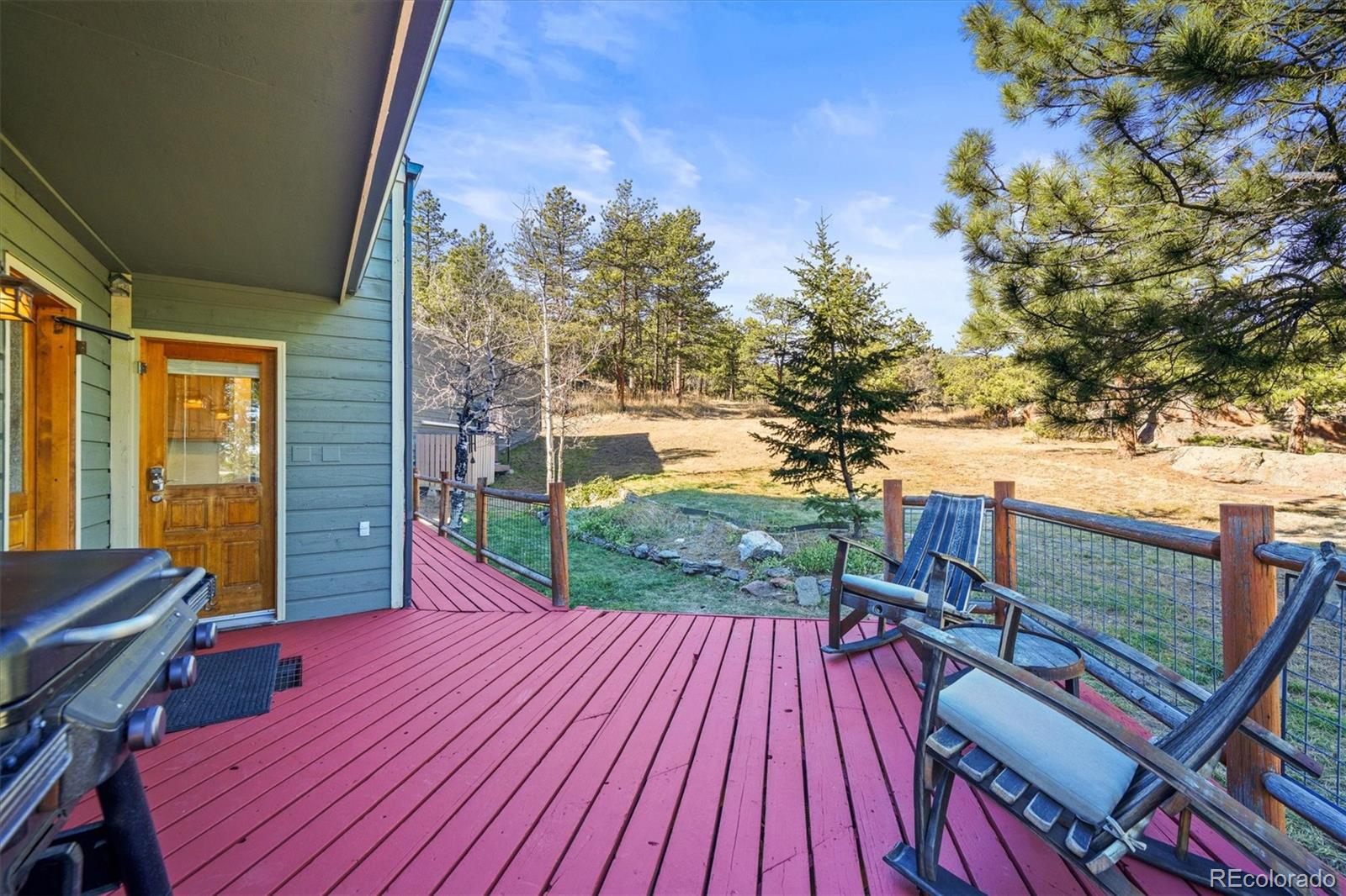 3665 Colard Lane Lyons, CO 80540 - Photo 17 of 50 a balcony with wooden floor