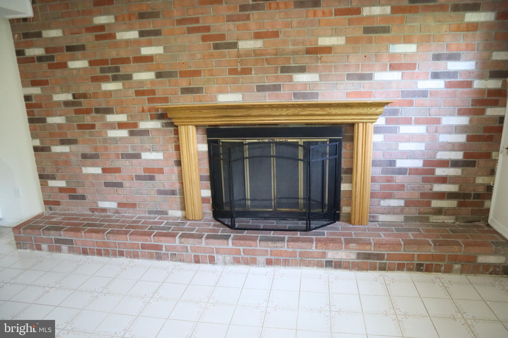 8501 Fairburn Drive Springfield, VA 22152 - Photo 14 of 30 a living room with a fireplace