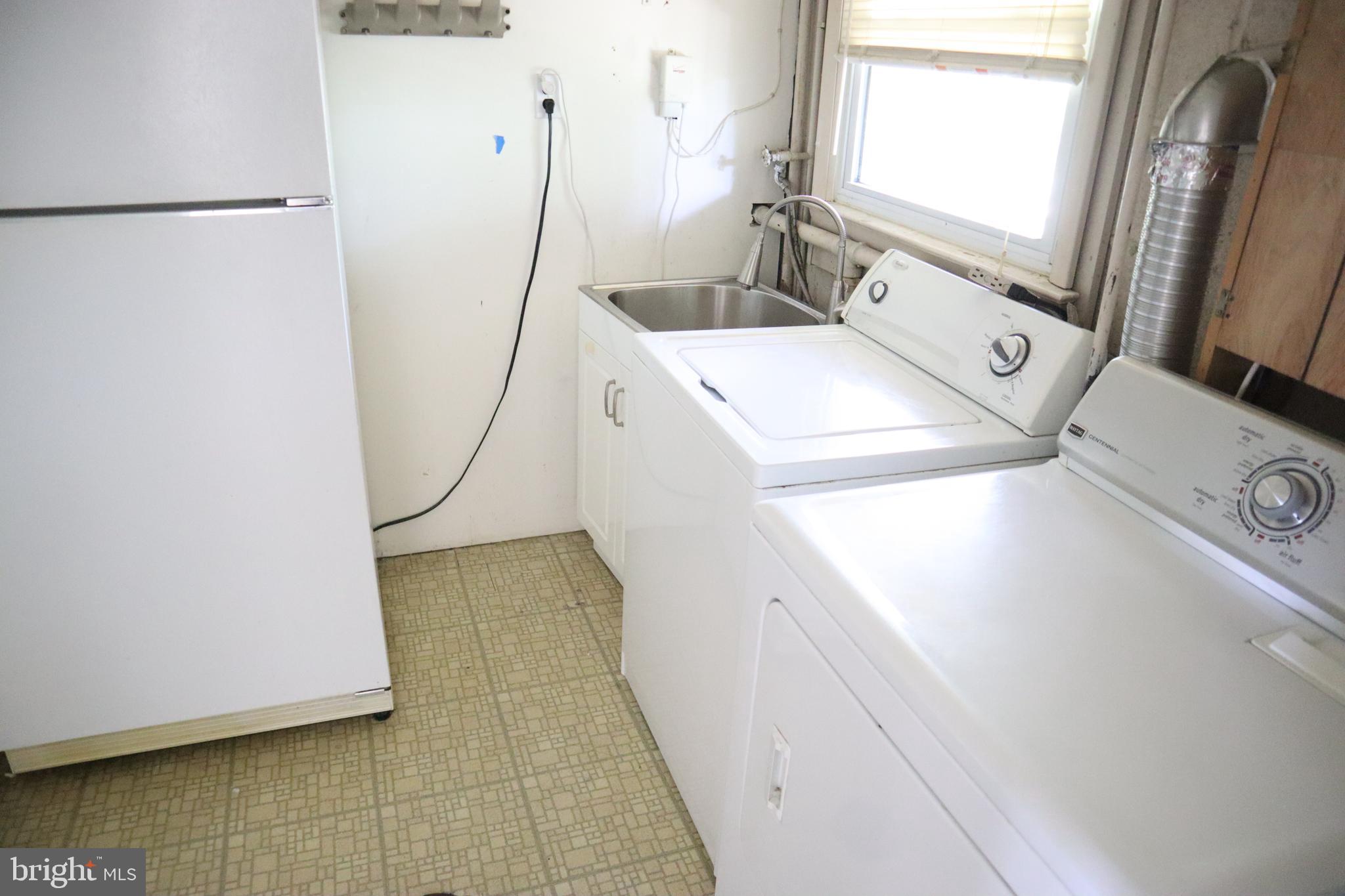 8501 Fairburn Drive Springfield, VA 22152 - Photo 21 of 30 a utility room with dryer and washer