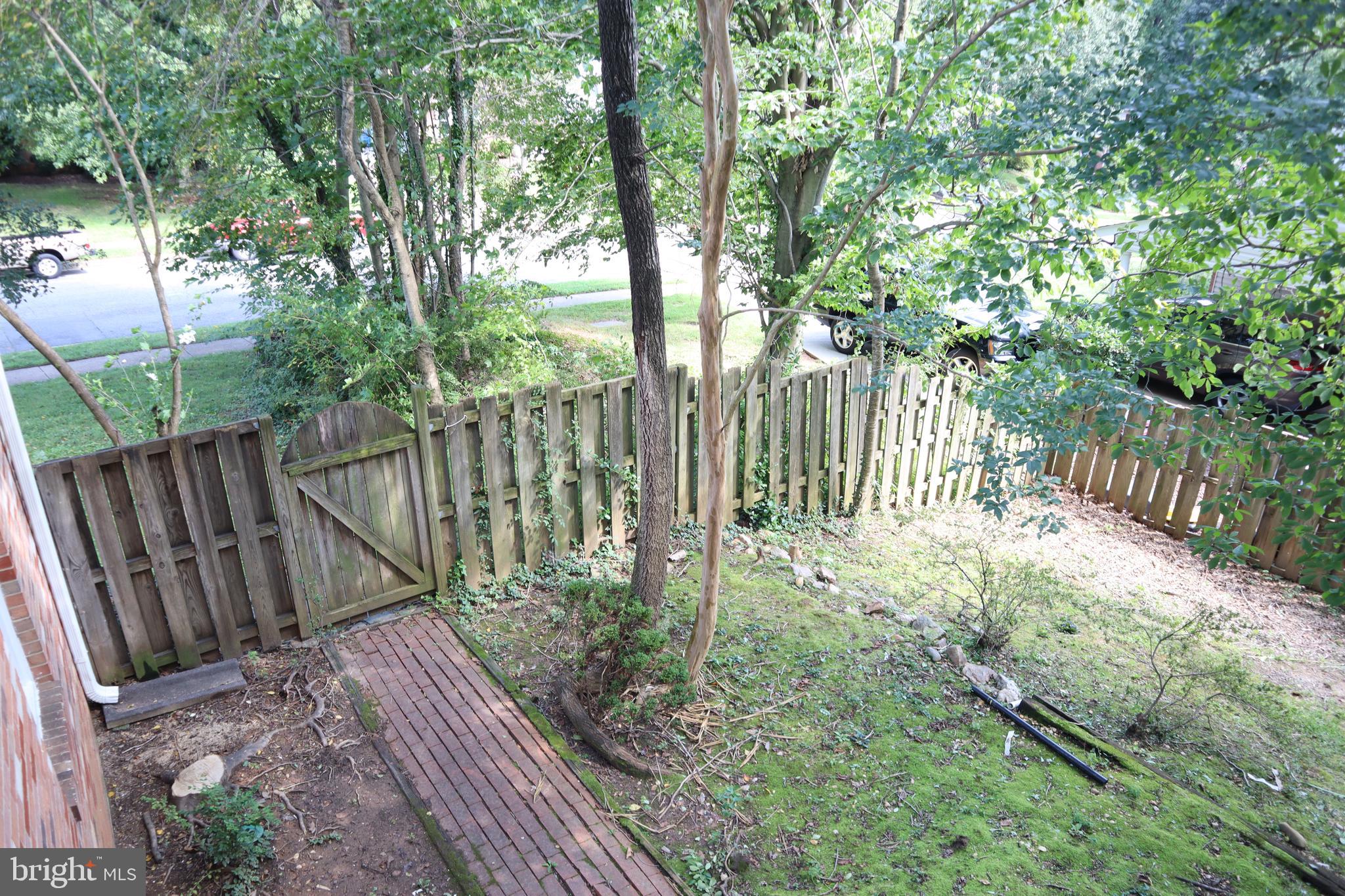 8501 Fairburn Drive Springfield, VA 22152 - Photo 24 of 30 a garden view with wooden fence