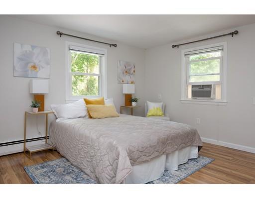 31 Concord Road Wayland, MA 01778 - Photo 7 of 17 a bedroom with a bed and wooden floor