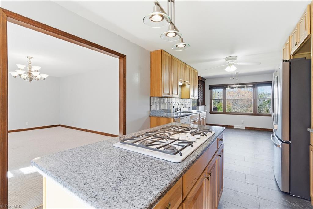 519 Riverside Drive Burlington, NC 27217 - Photo 12 of 39 Kitchen opens to dining room and den