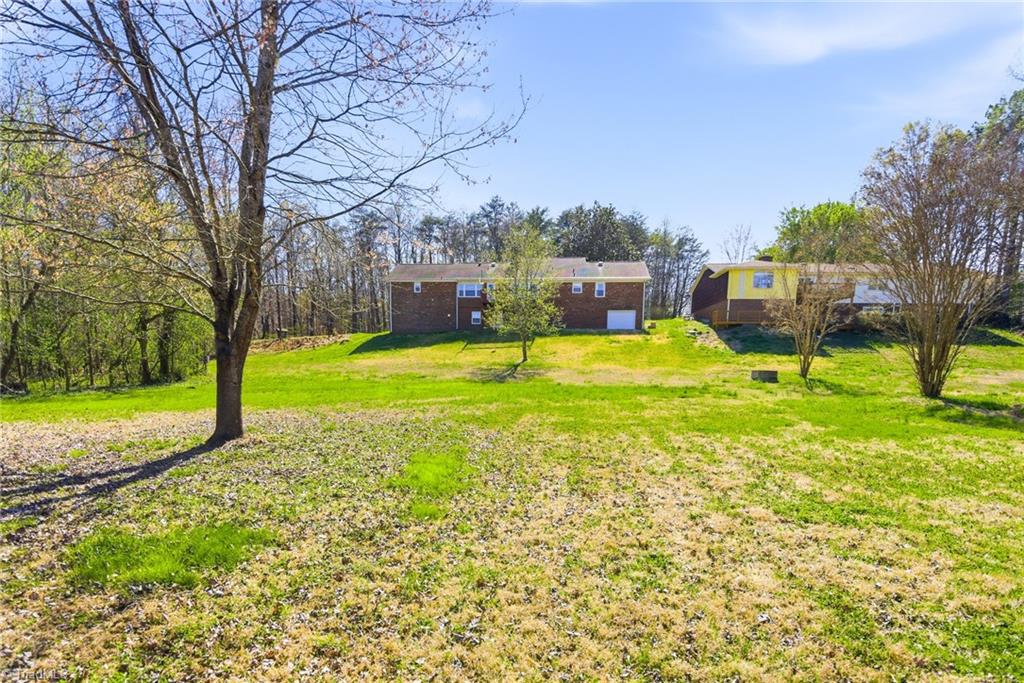 519 Riverside Drive Burlington, NC 27217 - Photo 30 of 39 Large back yard leads to the Haw River