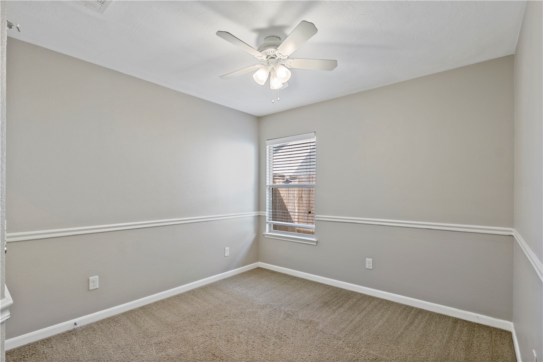 15427 Baker Meadow Loop College Station, TX 77845 - Photo 18 of 21 an empty room with windows and ceiling fan