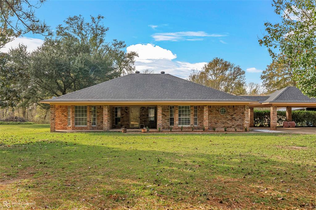 5425 Modica Lott Road Bossier City, LA 71111 - Photo 2 of 31 a view of a house with a yard