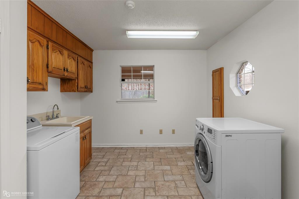 5425 Modica Lott Road Bossier City, LA 71111 - Photo 24 of 31 a utility room with sink dryer and washer