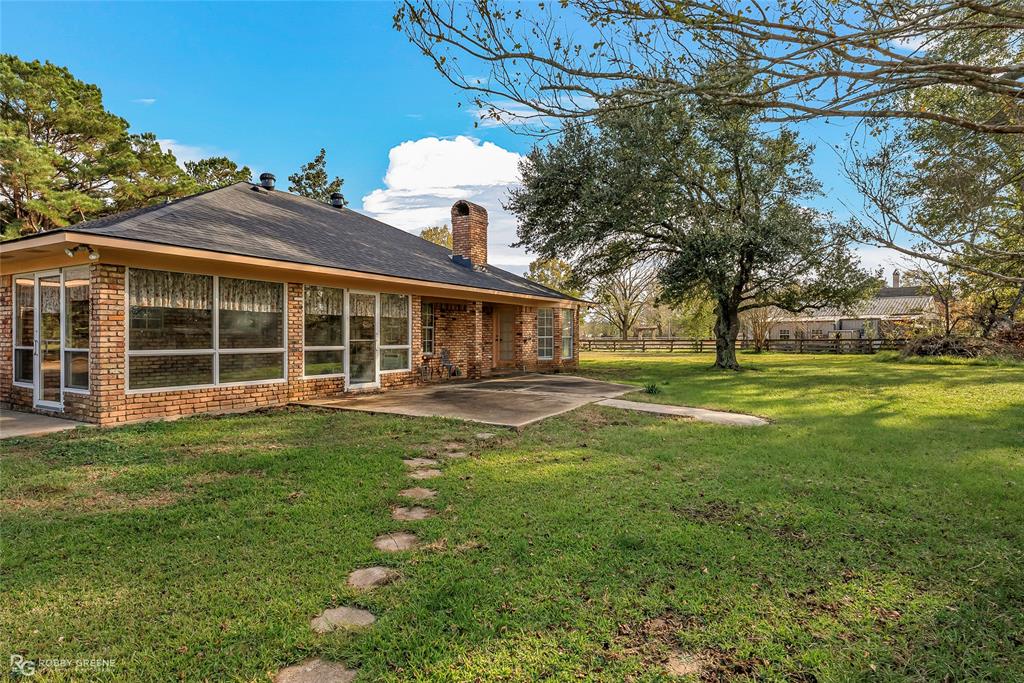 5425 Modica Lott Road Bossier City, LA 71111 - Photo 7 of 31 a view of a house with a yard