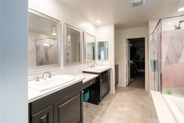 a bathroom with a double vanity sink and a mirror