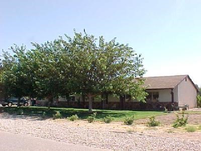 15377 Apache Road Apple Valley, CA 92307 - Photo 1 of 1 a backyard of a house with lots of green space