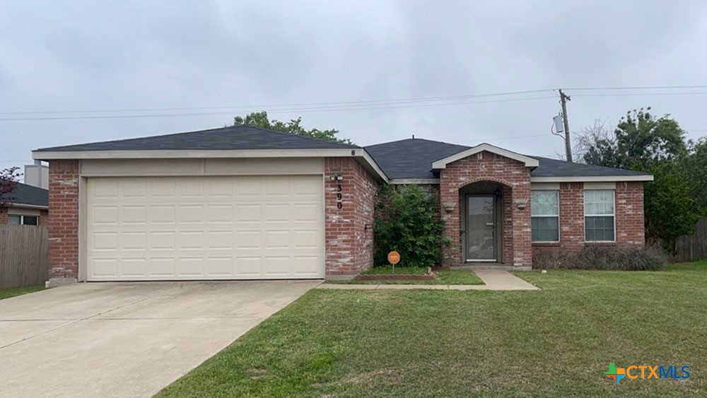 3904 Bull Run Drive Killeen, TX 76549 - Photo 1 of 14 a front view of a house with a garden and yard