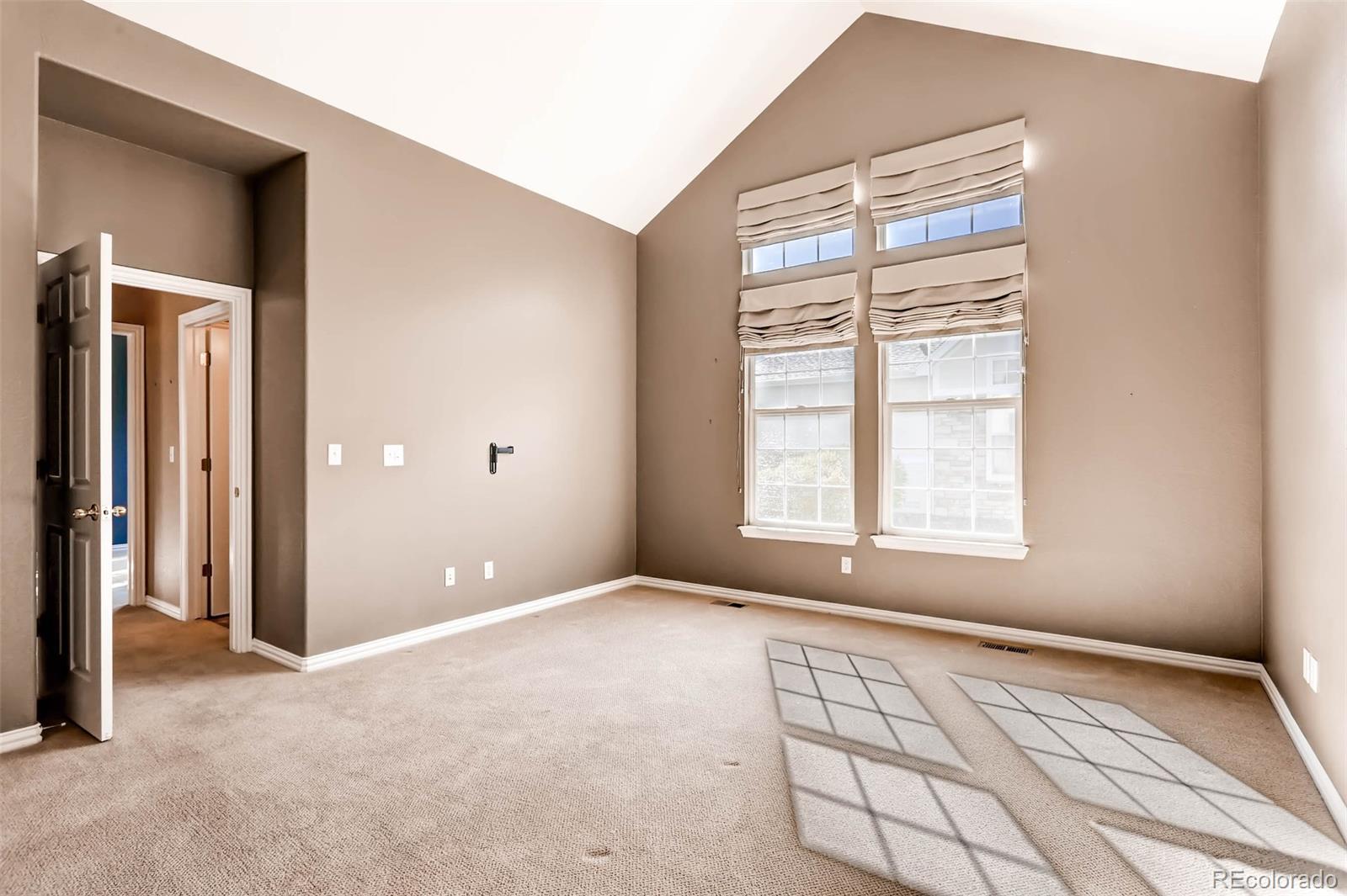 8300 Fairmount Drive, Unit N101 Denver, CO 80247 - Photo 15 of 27 a view of an empty room with a window