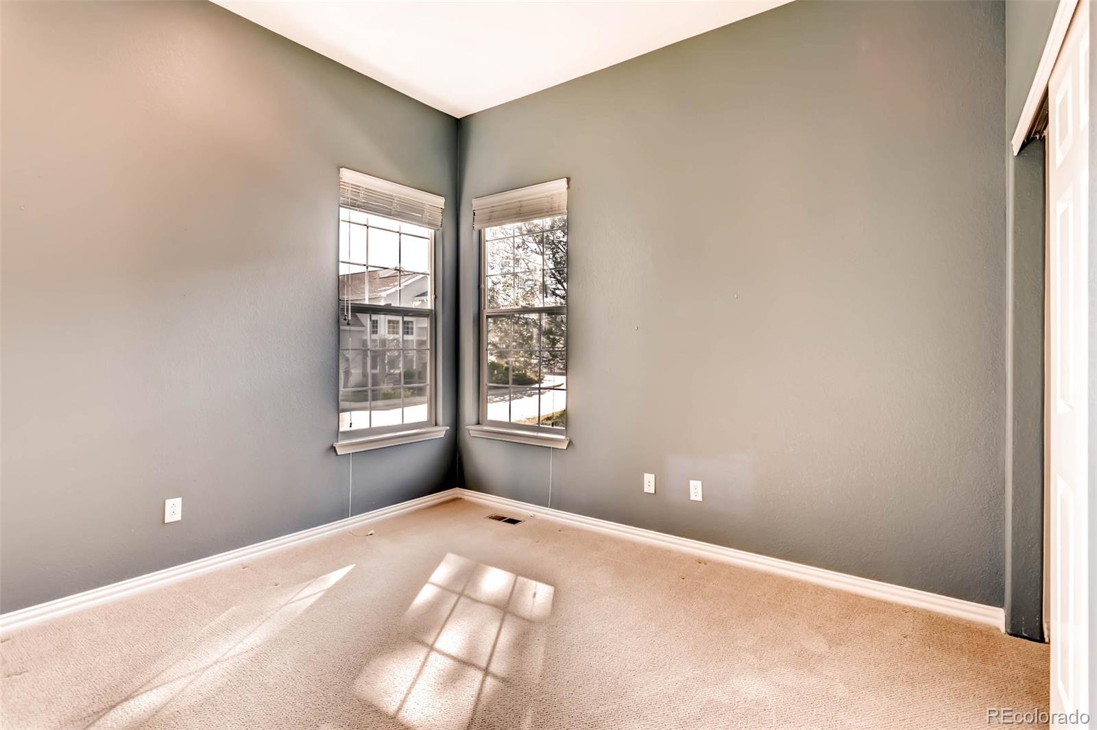 8300 Fairmount Drive, Unit N101 Denver, CO 80247 - Photo 19 of 27 a view of an empty room with a window
