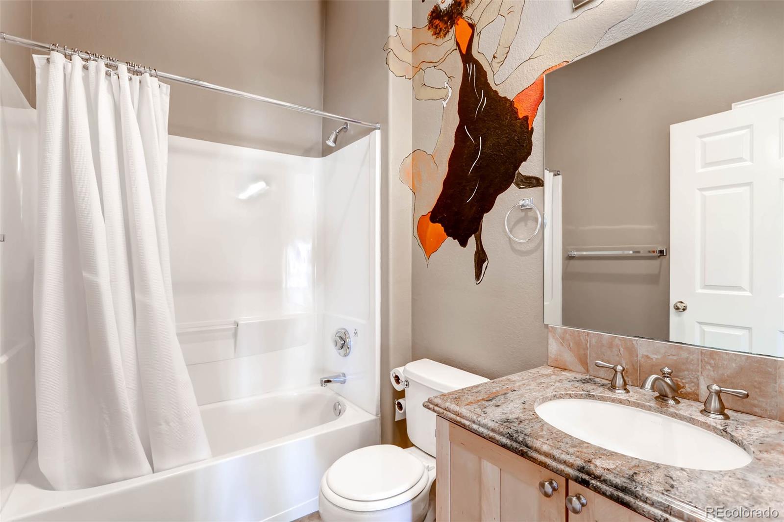 8300 Fairmount Drive, Unit N101 Denver, CO 80247 - Photo 22 of 27 a bathroom with a granite countertop sink toilet and shower