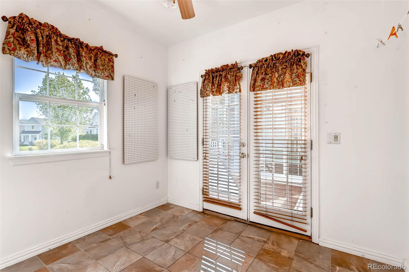 8300 Fairmount Drive, Unit N101 Denver, CO 80247 - Photo 24 of 27 a view of a room that has a window in it