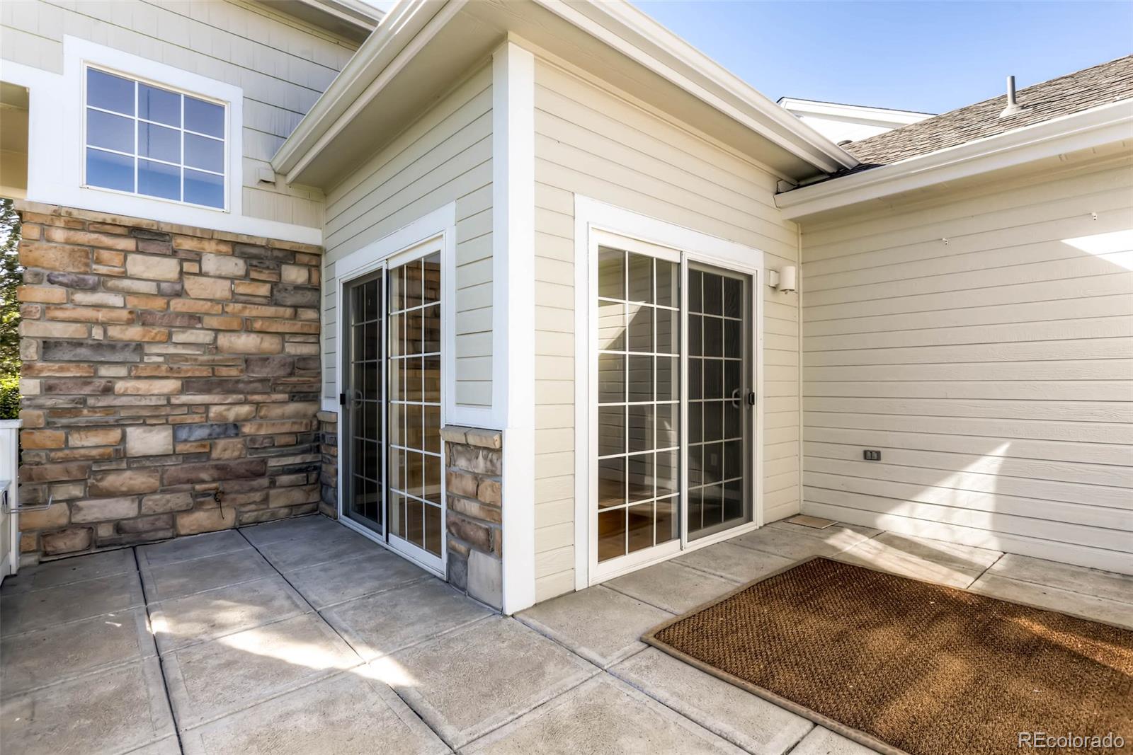 8300 Fairmount Drive, Unit N101 Denver, CO 80247 - Photo 26 of 27 a view of front door of house with an window