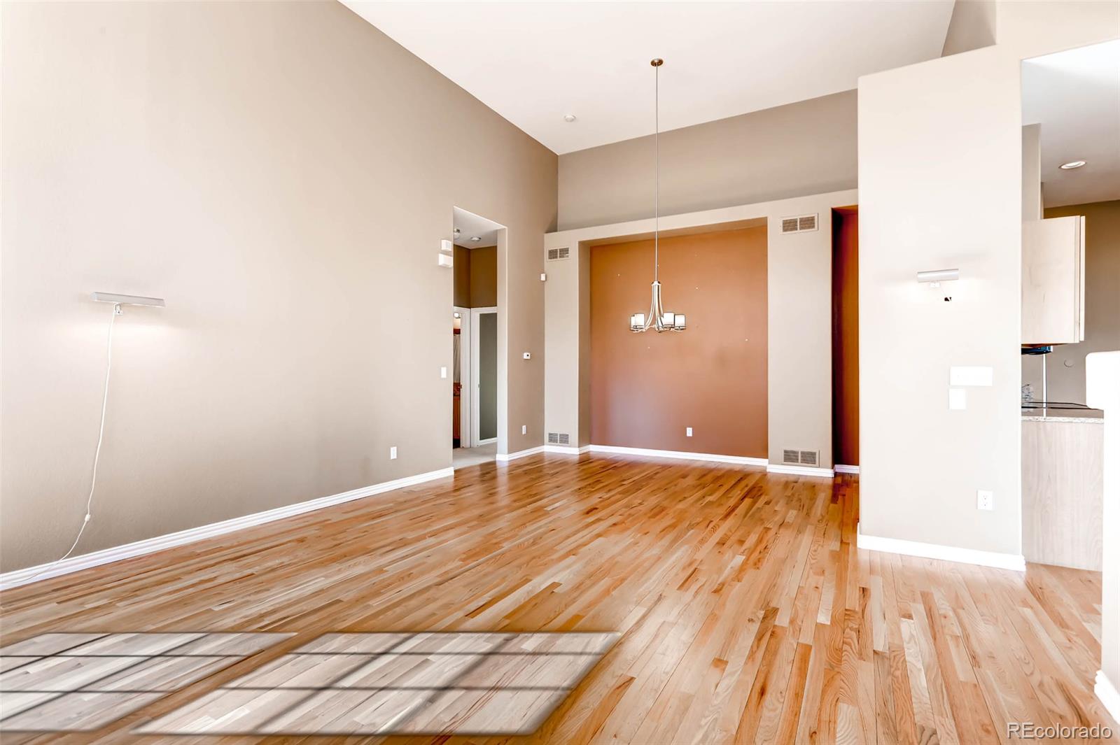 8300 Fairmount Drive, Unit N101 Denver, CO 80247 - Photo 5 of 27 a view of an empty room with wooden floor