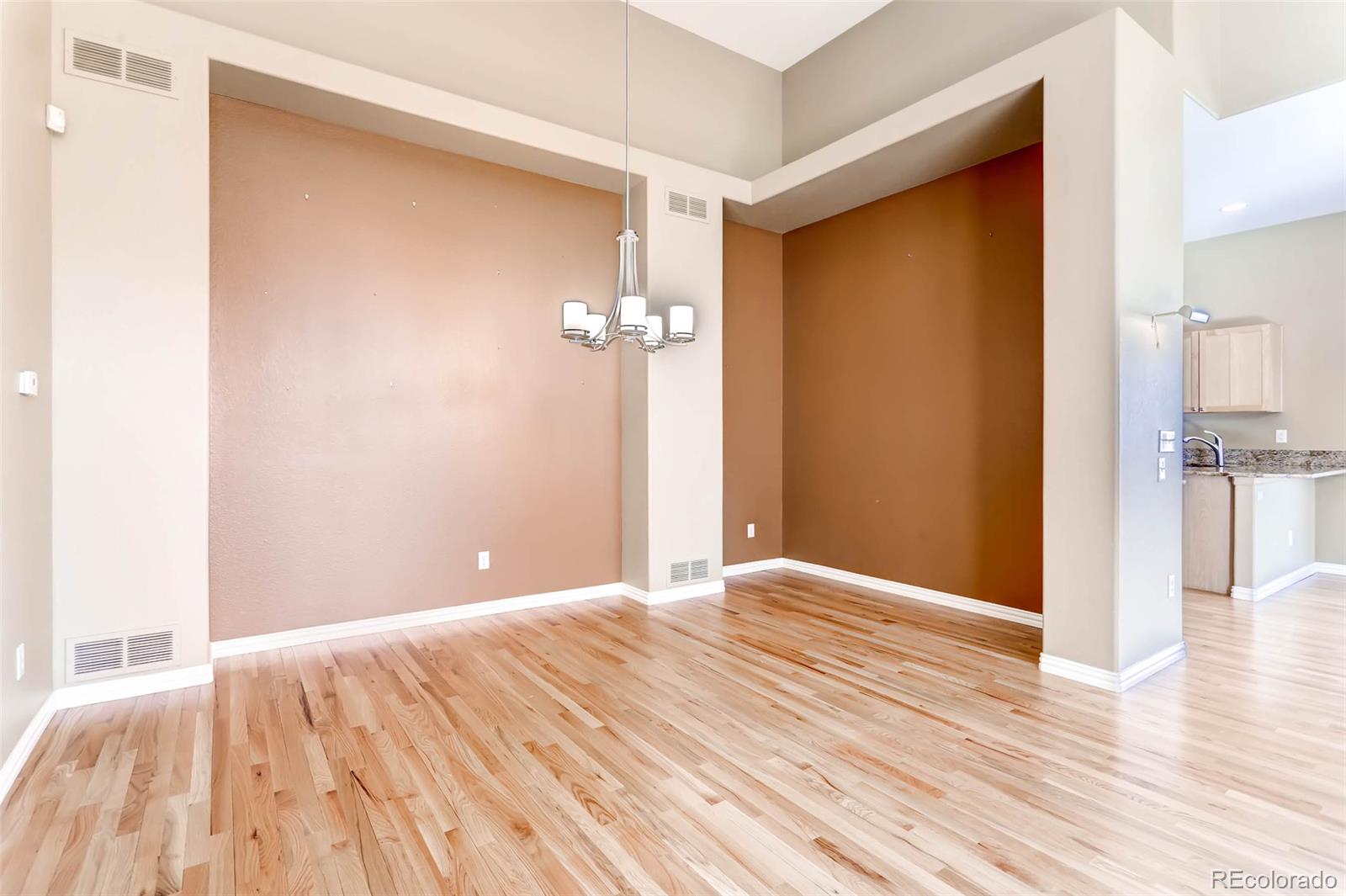 8300 Fairmount Drive, Unit N101 Denver, CO 80247 - Photo 7 of 27 a view of a room with wooden floor