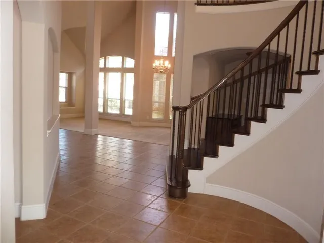 a view of an entryway with wooden floor