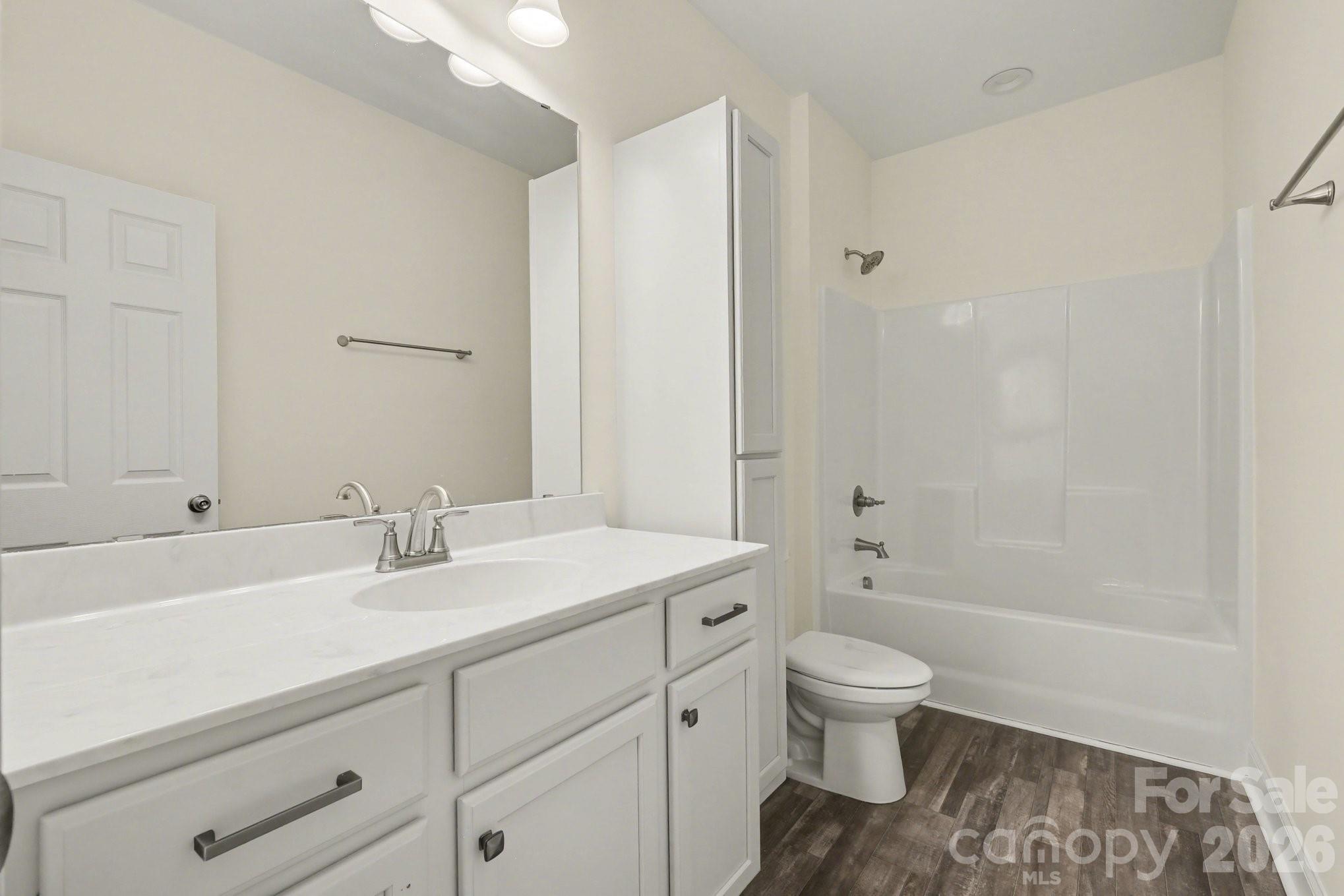 175 Cox Lake Road Stanley, NC 28164 - Photo 16 of 45 a bathroom with a sink a toilet and shower