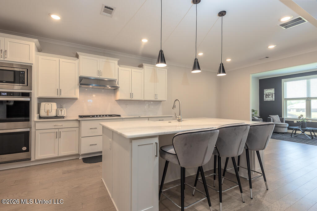 467 Ruskin Loop Hernando, MS 38632 - Photo 10 of 28 Kitchen into Breakfast & Sunroom