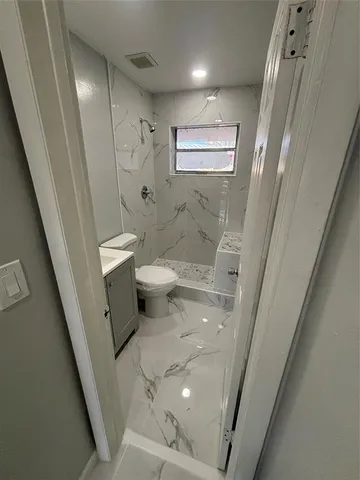 a bathroom with a sink and toilet
