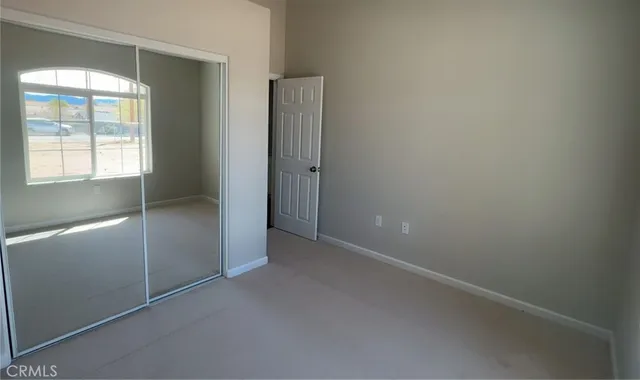 a bathroom with a double vanity sink mirror and toilet