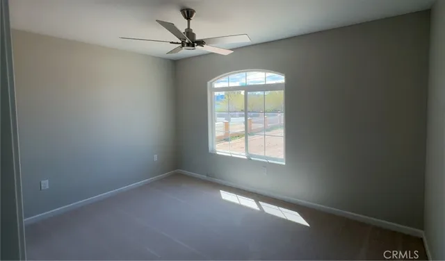 a view of a house with a snow in front of yard