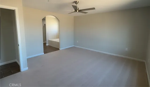 an empty room with a mirror